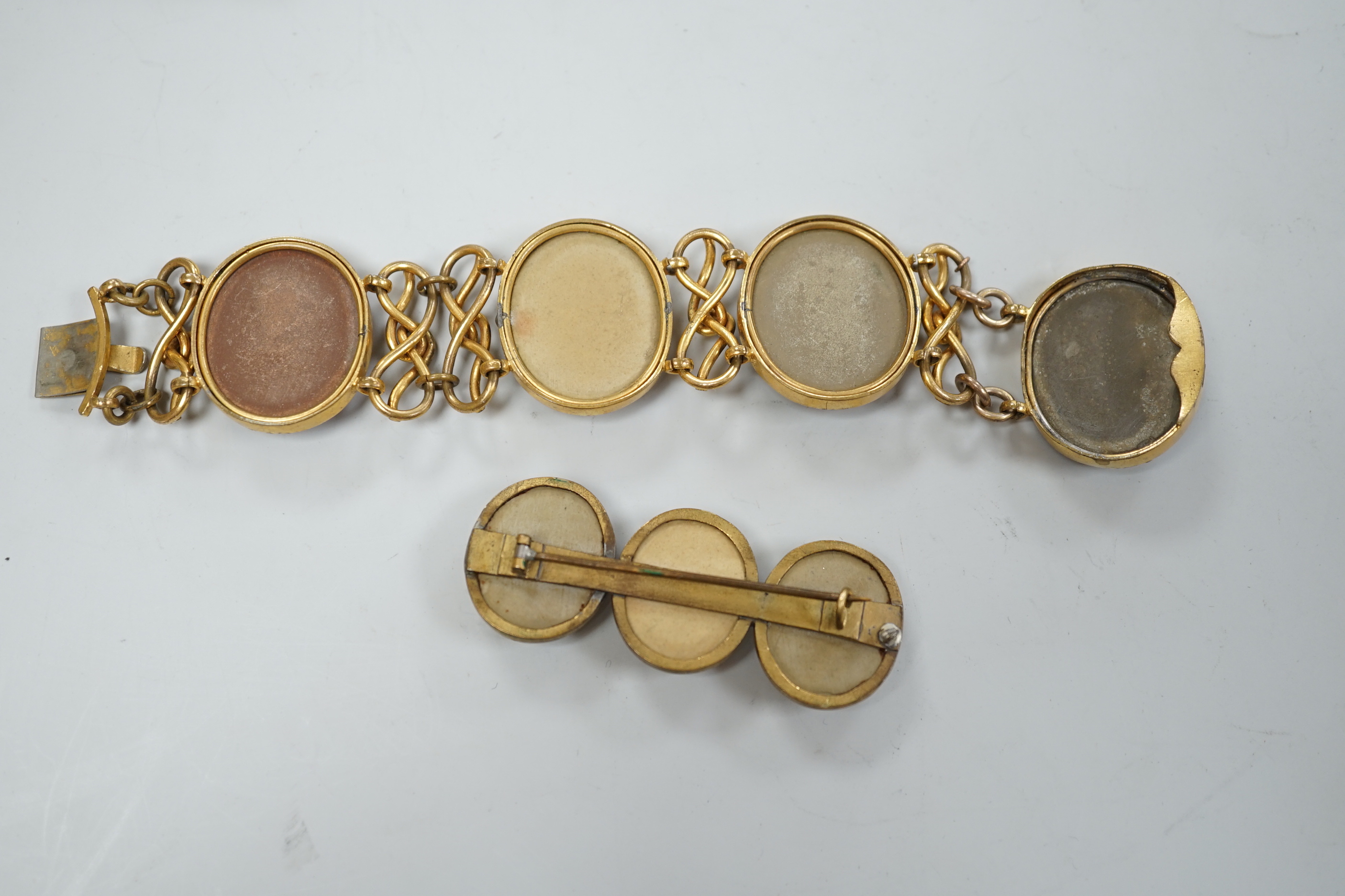 A 19th century gilt metal and oval lava panel set bracelet, 16.8cm and a similar brooch.